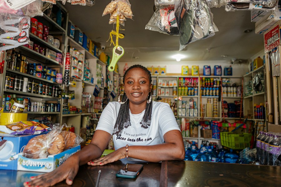Shopkeeper at the counter of her retail shop